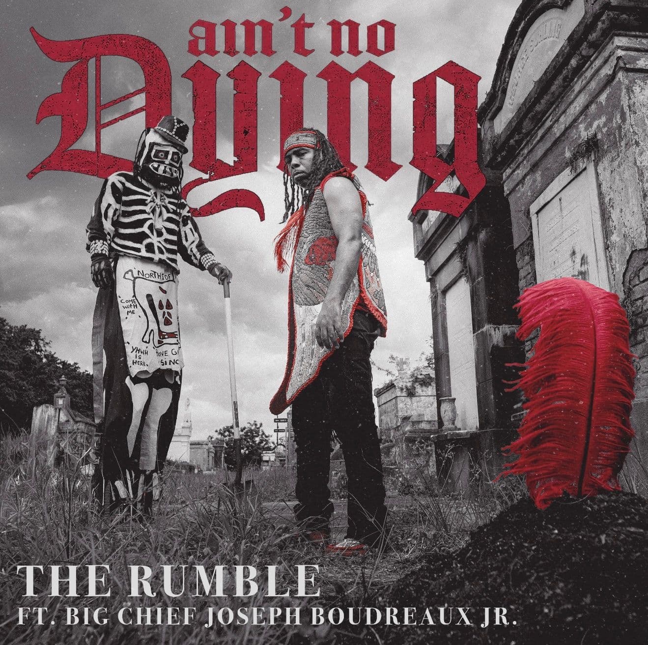 Ain't No Dying album cover: Big Chief Joseph Boudreaux Jr. and a Northside Skull and Bone Gang member in a New Orleans cemetery, with a single red feather